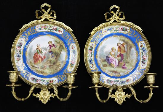 A pair of Sevres style porcelain and gilt bronze mounted wall lights, 38cm